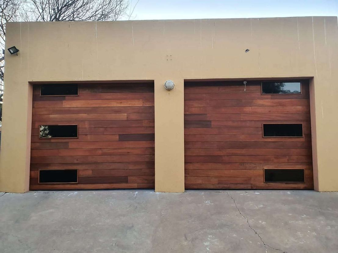 Single Meranti Finger Jointed Slat Garage Doors with Glass Inserts homify