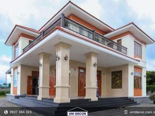 Binh Yen' House - Biệt thự mái nhật 2 tầng tại thị trấn Đất Đỏ, Bà Rịa Vũng Tàu, CÔNG TY TNHH THIẾT KẾ & XÂY DỰNG UNI DECOR CÔNG TY TNHH THIẾT KẾ & XÂY DỰNG UNI DECOR Single family home
