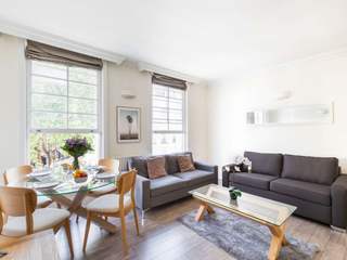 A touch of sophistication in London's Living Rooms UpperKey Minimalistische Wohnzimmer Table, Couch, Property, Plant, Furniture, Window, Houseplant, Picture frame, studio couch, Interior design