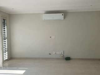 BEFORE IMAGE OF LOUNGE AREA BRYANSTON Deborah Garth Interior Design International (Pty)Ltd Single family home Fixture, Flooring, Floor, Building, Tile flooring, Beige,concrete,ceiling