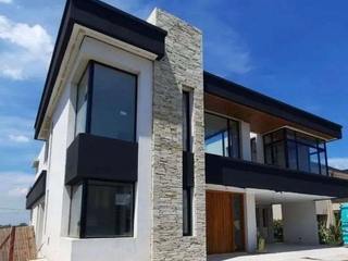 CASA EN CANNING, ABSTRACT Arquitectura + Diseño ABSTRACT Arquitectura + Diseño منزل عائلي صغير